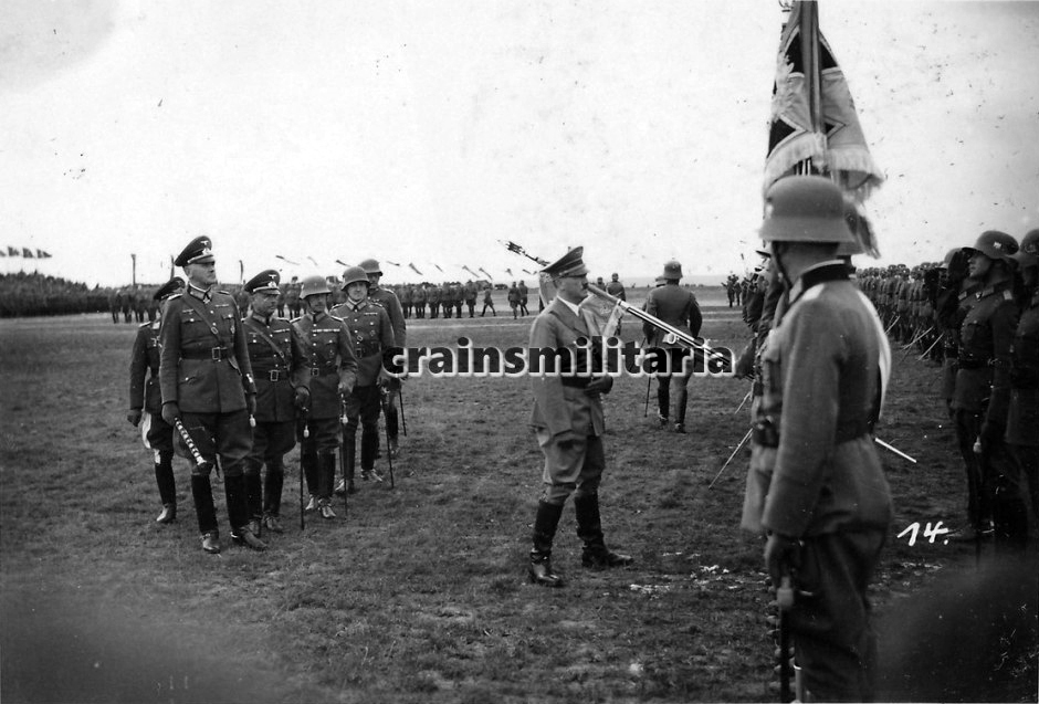 Adolf Hitler, joined by several generals and staff officers, during the parade of the V. Armeekorps in Giebelstadt, near Würzburg